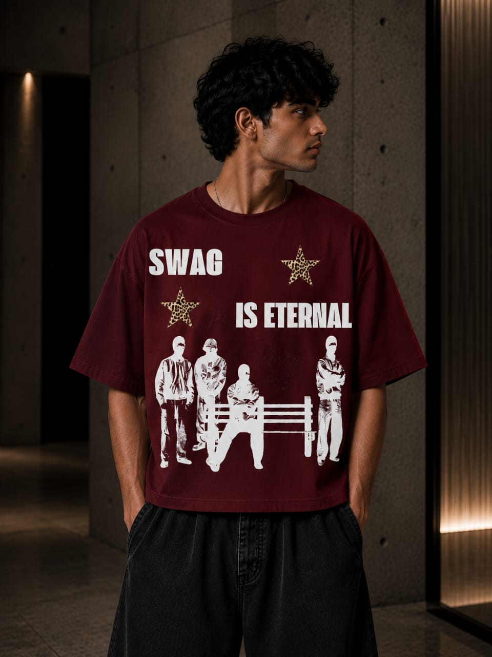 Person wearing a maroon t-shirt with 'SWAG IS ETERNAL' text and graphic design.